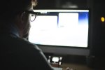 man-in-front-of-computer-monitor-working.jpg